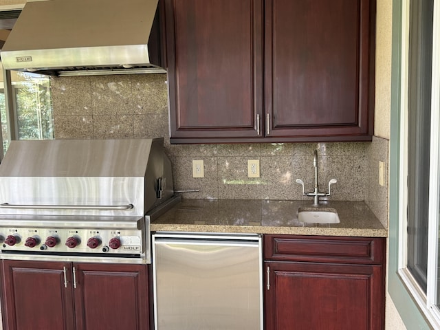 62-3600 Amaui Pl Unit 345, Kamuela, HI 96743 - kitchen featuring wall chimney range hood, tasteful backsplash, fridge, and dark stone countertops