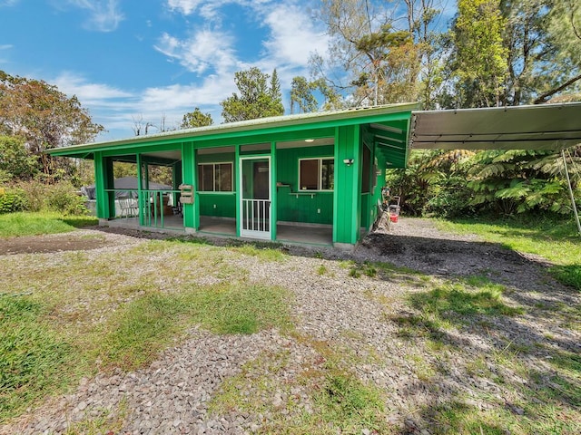 11-3057 Anuhea St, Volcano, HI 96785 - view of front of property with a metal roof and a carport