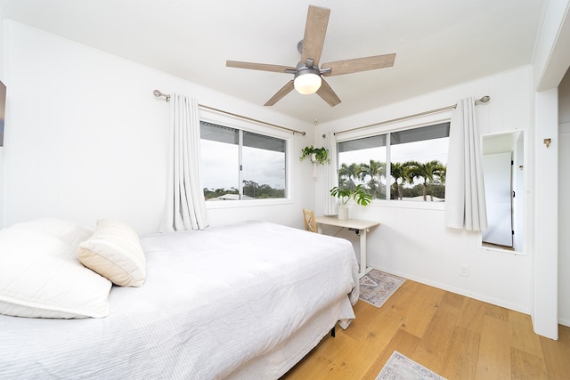 17-436 Ipuaiwaha St, Keaau, HI 96749 - bedroom with light wood-type flooring and ceiling fan