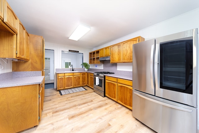 17-436 Ipuaiwaha St, Keaau, HI 96749 - kitchen featuring appliances with stainless steel finishes, under cabinet range hood, light wood-style flooring, light countertops, and brown cabinets