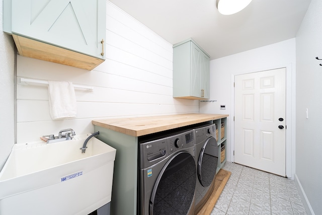 17-436 Ipuaiwaha St, Keaau, HI 96749 - laundry area with washer and dryer, cabinet space, and light tile patterned floors