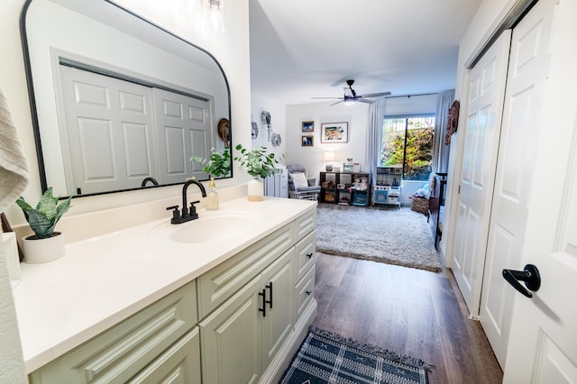 75-5863 Kuakini Hwy Unit 104, Kailua-Kona, HI 96740 - bathroom with vanity, ceiling fan, and wood finished floors