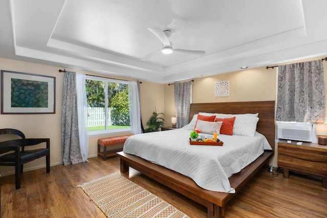 68-1740 Akaula St, Waikoloa, HI 96738 - bedroom featuring a raised ceiling, wood finished floors, a ceiling fan, and cooling unit