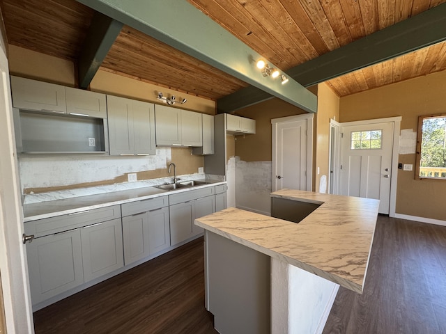 11-3135 Alii Kane St, Volcano, HI 96785 - kitchen featuring a wood ceiling with exposed beams, light countertops, dark wood-type flooring, a center island, and backsplash