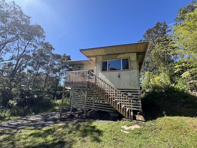 11-3135 Alii Kane St, Volcano, HI 96785 - back of property with stairway and a deck