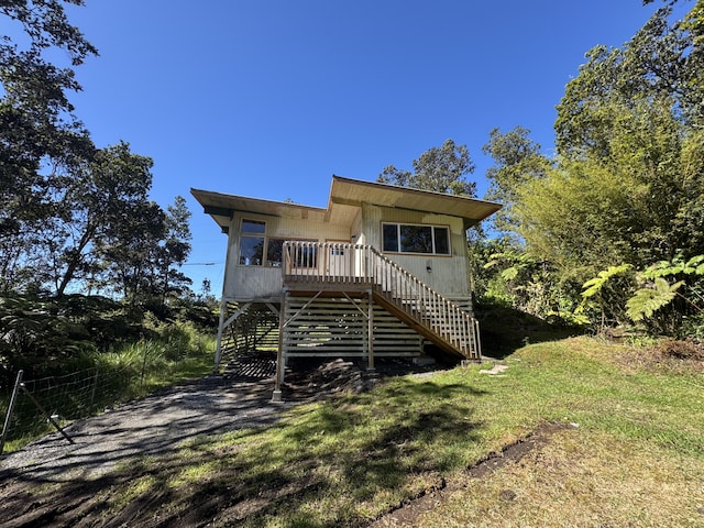 11-3135 Alii Kane St, Volcano, HI 96785 - view of front facade with stairway and a front yard