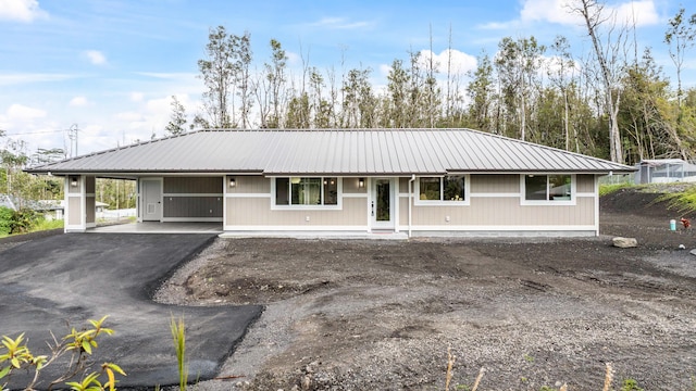 16-2110 Tangerine Dr, Pahoa, HI 96778 - single story home featuring a carport, a metal roof, and driveway