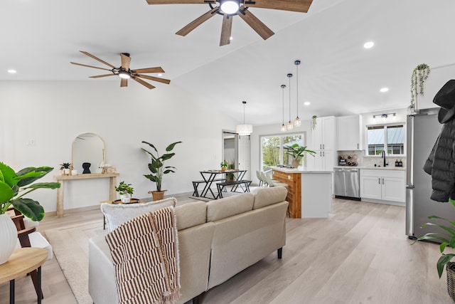 16-2110 Tangerine Dr, Pahoa, HI 96778 - living room featuring ceiling fan, recessed lighting, lofted ceiling, and light wood-style floors