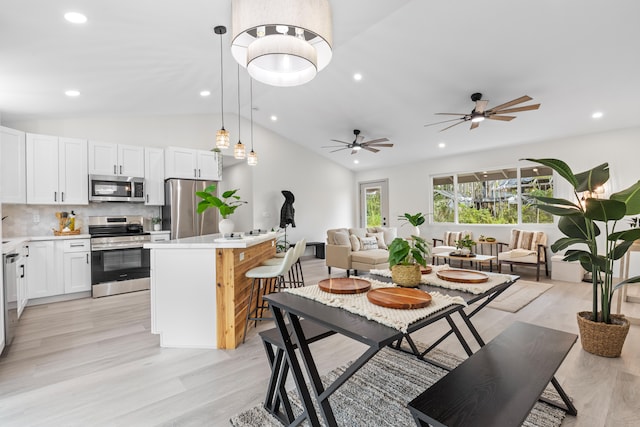 16-2110 Tangerine Dr, Pahoa, HI 96778 - dining area featuring lofted ceiling, recessed lighting, light wood finished floors, and ceiling fan