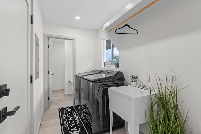 16-2110 Tangerine Dr, Pahoa, HI 96778 - washroom with washing machine and dryer, light wood finished floors, and recessed lighting