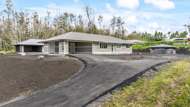 16-2110 Tangerine Dr, Pahoa, HI 96778 - ranch-style home featuring a metal roof and driveway