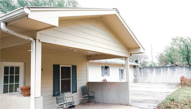 view of side of home featuring a patio area