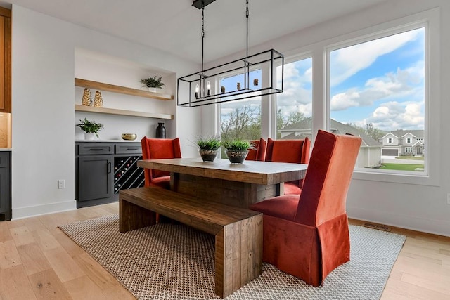 dining space featuring light hardwood / wood-style floors and plenty of natural light