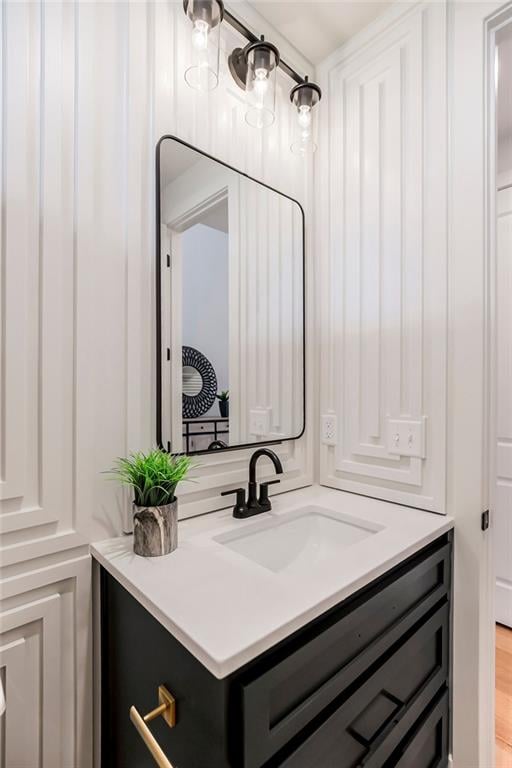 bathroom featuring hardwood / wood-style floors and vanity