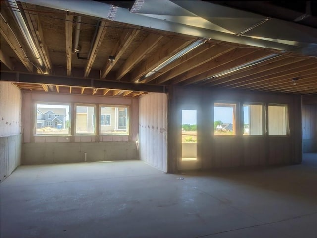 miscellaneous room featuring concrete floors and a wealth of natural light