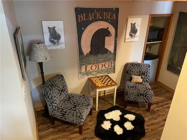 living area with hardwood / wood-style flooring