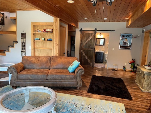 living room with dark hardwood / wood-style flooring, wood ceiling, and a barn door