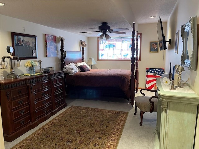 bedroom featuring ceiling fan and a textured ceiling