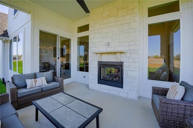 view of patio / terrace with an outdoor living space with a fireplace