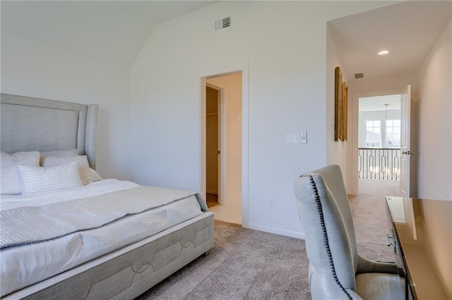 bedroom with carpet and lofted ceiling