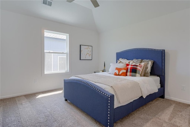 carpeted bedroom featuring lofted ceiling, multiple windows, and ceiling fan