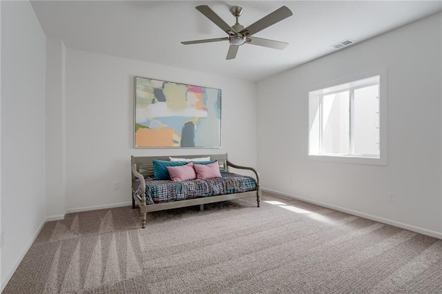 sitting room featuring ceiling fan and carpet flooring