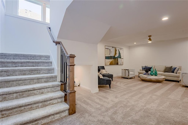 living room featuring carpet flooring and ceiling fan