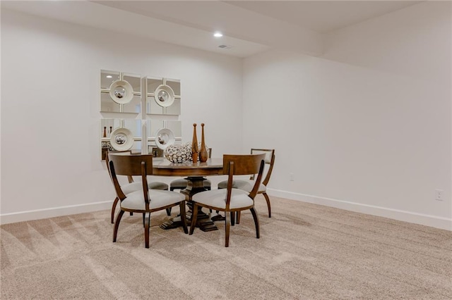 view of carpeted dining space