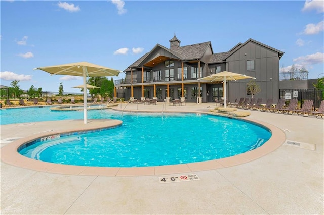 view of swimming pool with a patio