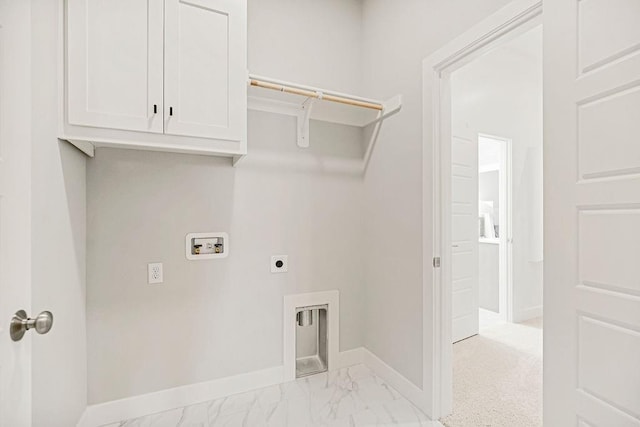 clothes washing area featuring washer hookup, electric dryer hookup, and cabinets