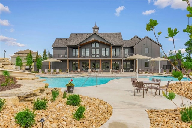 view of swimming pool featuring a patio