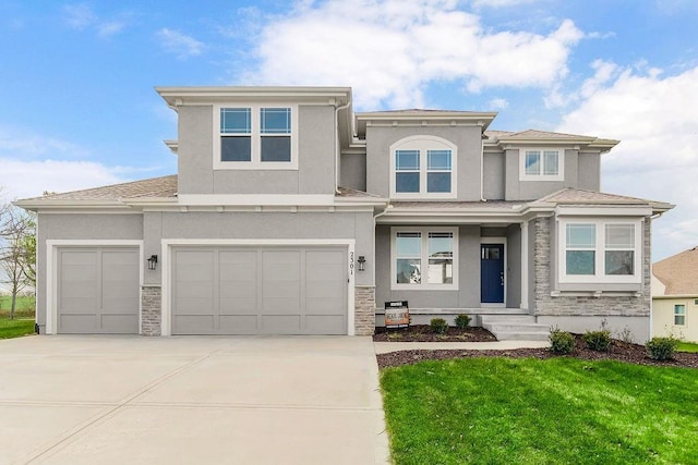 2301 W 180th St, Overland Park, KS 66085 - prairie-style house with stone siding, stucco siding, driveway, and a front lawn