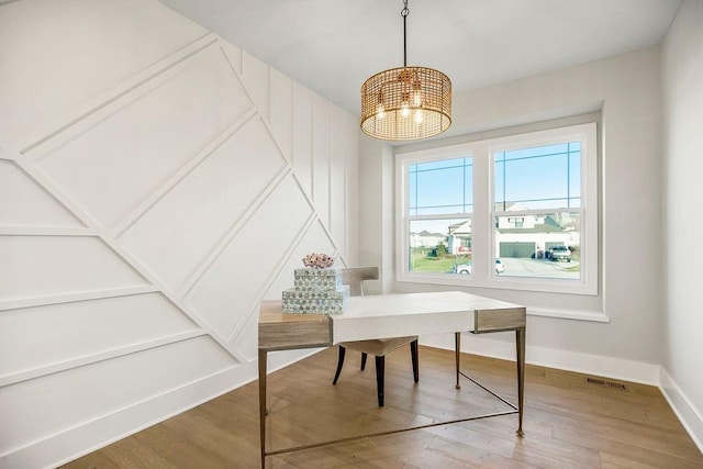 2301 W 180th St, Overland Park, KS 66085 - home office with wood finished floors, a chandelier, and baseboards