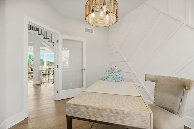 2301 W 180th St, Overland Park, KS 66085 - dining area featuring a chandelier, wood finished floors, and baseboards