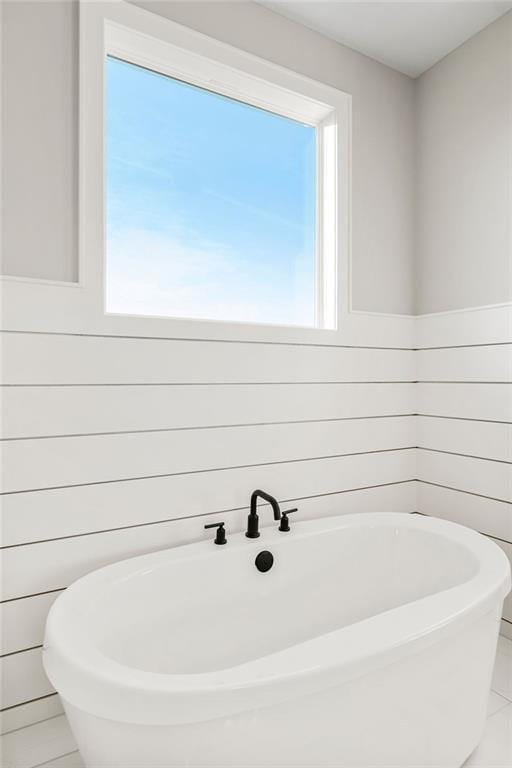 2301 W 180th St, Overland Park, KS 66085 - bathroom featuring a freestanding bath