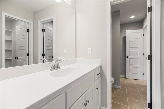 25025 W 92nd St, Lenexa, KS 66227 - bathroom with baseboards, toilet, tile patterned flooring, and vanity