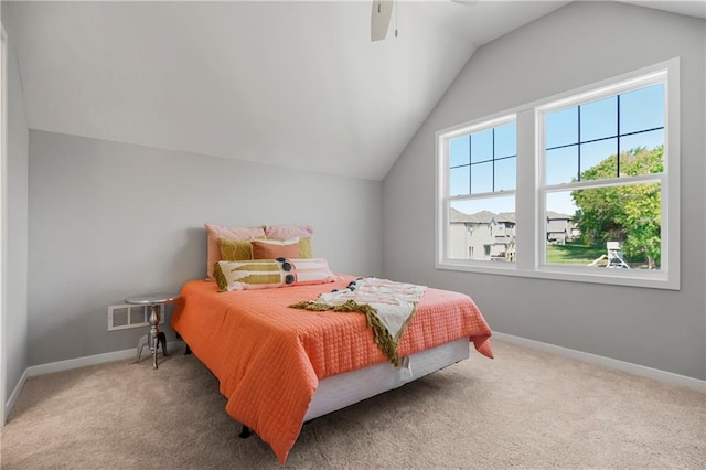 carpeted bedroom with lofted ceiling and ceiling fan