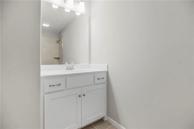 25025 W 92nd St, Lenexa, KS 66227 - bathroom featuring tile patterned floors, a shower, vanity, and baseboards