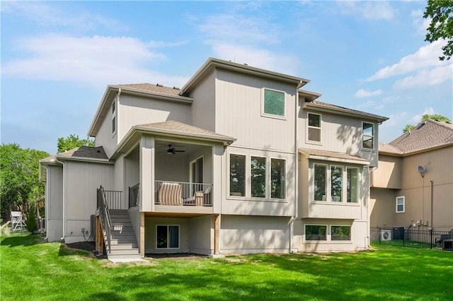 25025 W 92nd St, Lenexa, KS 66227 - back of house featuring a lawn, ceiling fan, stairway, and fence