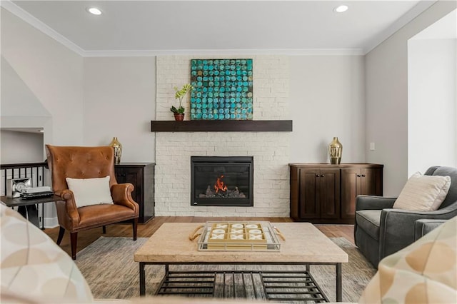 25025 W 92nd St, Lenexa, KS 66227 - living area featuring ornamental molding, recessed lighting, wood finished floors, and a fireplace