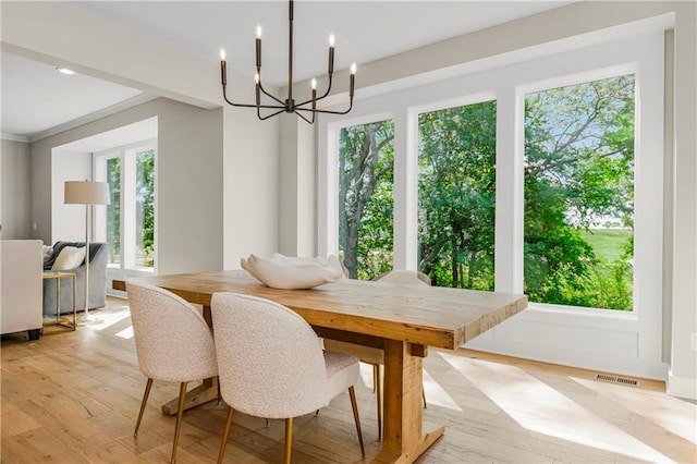 25025 W 92nd St, Lenexa, KS 66227 - dining space featuring an inviting chandelier, light wood-style floors, and plenty of natural light