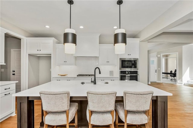 25025 W 92nd St, Lenexa, KS 66227 - kitchen featuring recessed lighting, a sink, decorative backsplash, white cabinetry, and appliances with stainless steel finishes