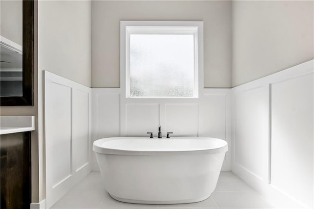 25025 W 92nd St, Lenexa, KS 66227 - full bathroom featuring a decorative wall, a soaking tub, and tile patterned flooring