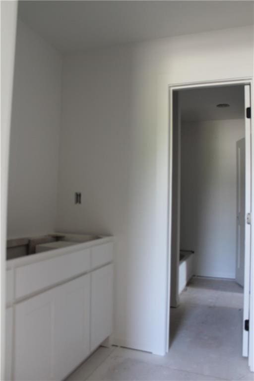 bathroom with concrete flooring