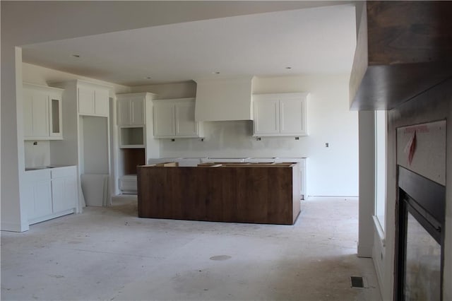 kitchen with a center island and white cabinets