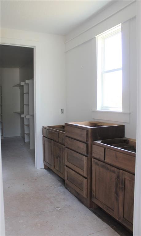 kitchen featuring dark brown cabinets