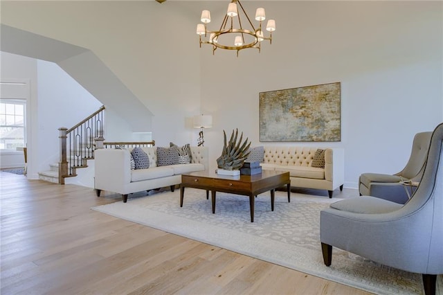 living room with a chandelier and wood-type flooring