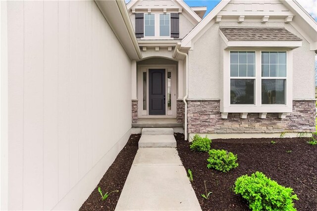 16388 S Brougham Dr, Olathe, KS 66062 - doorway to property with stucco siding and stone siding