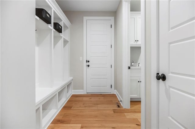 16388 S Brougham Dr, Olathe, KS 66062 - mudroom featuring baseboards and light wood finished floors