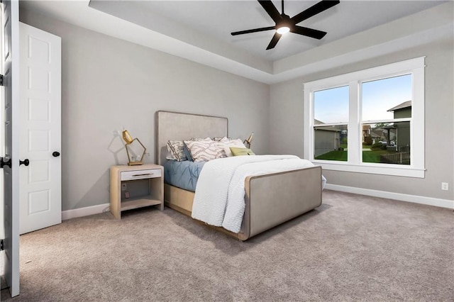 16388 S Brougham Dr, Olathe, KS 66062 - carpeted bedroom with a raised ceiling, baseboards, and a ceiling fan
